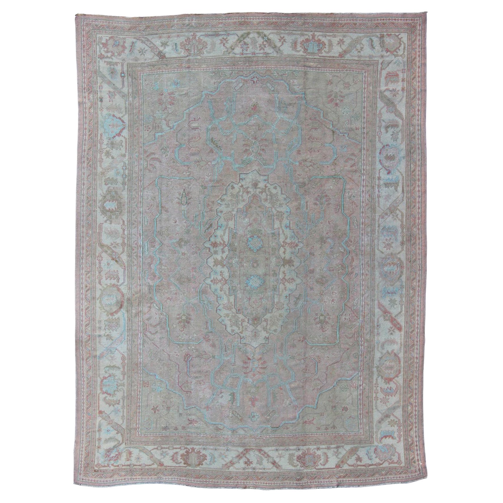 Large Antique Oushak Carpet in Light Pink Background with Light Blue Highlights For Sale