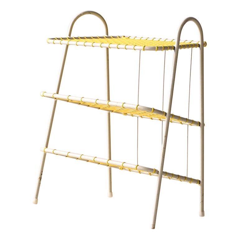 Metal and yellow rubber magazine rack For Sale