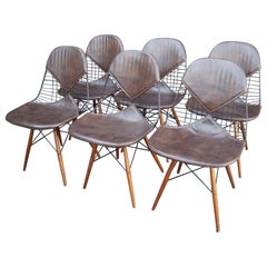 Vintage Set of Six Wire Chairs with Dowel Legs and Bikini Pad by Charles and Ray Eames