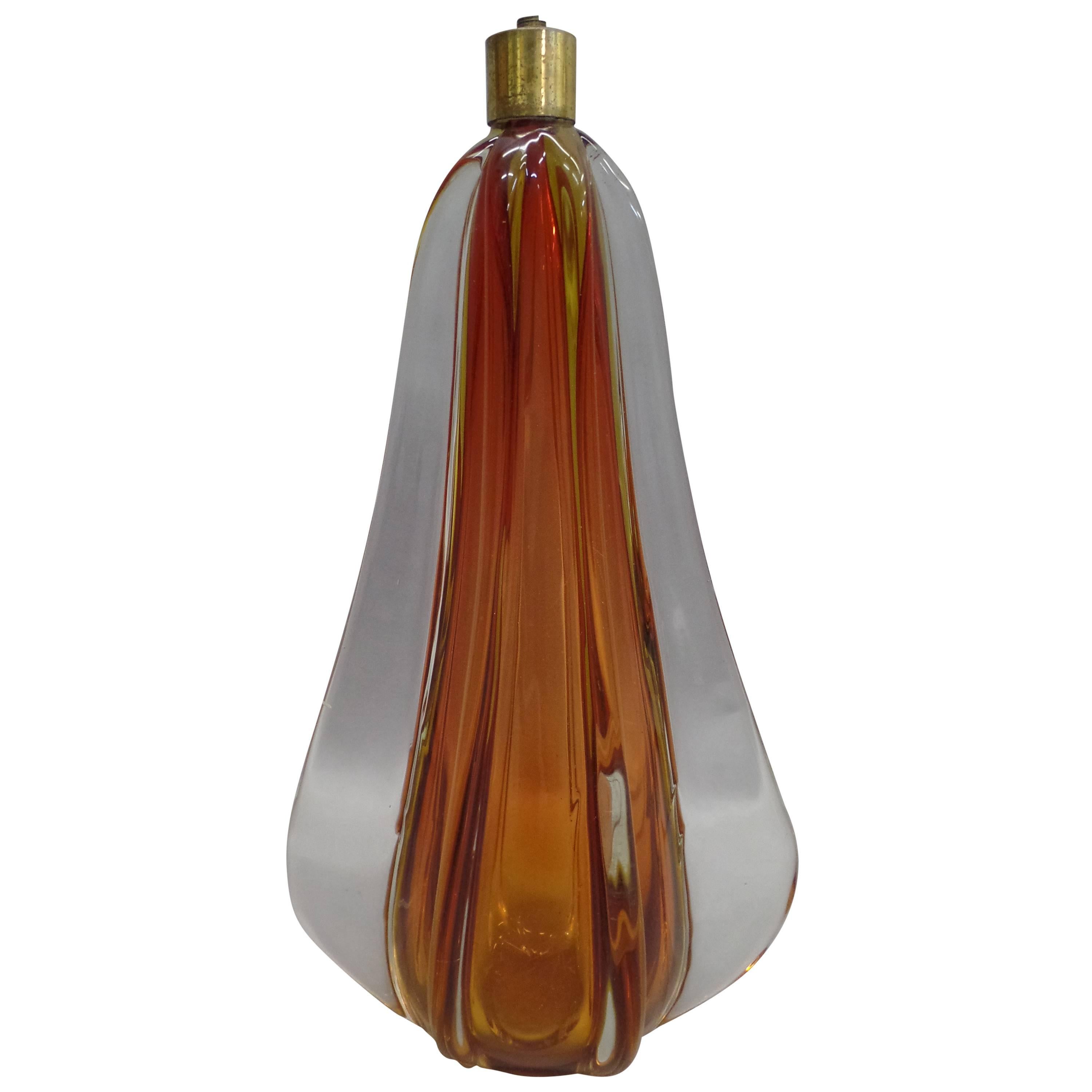 Handblown Italian, Mid-Century Modern table lamp base by Seguso, ribbed and tapered in amber and clear glass.

Elegant and an excellent example of Italian mixture of art and design in a functional object.