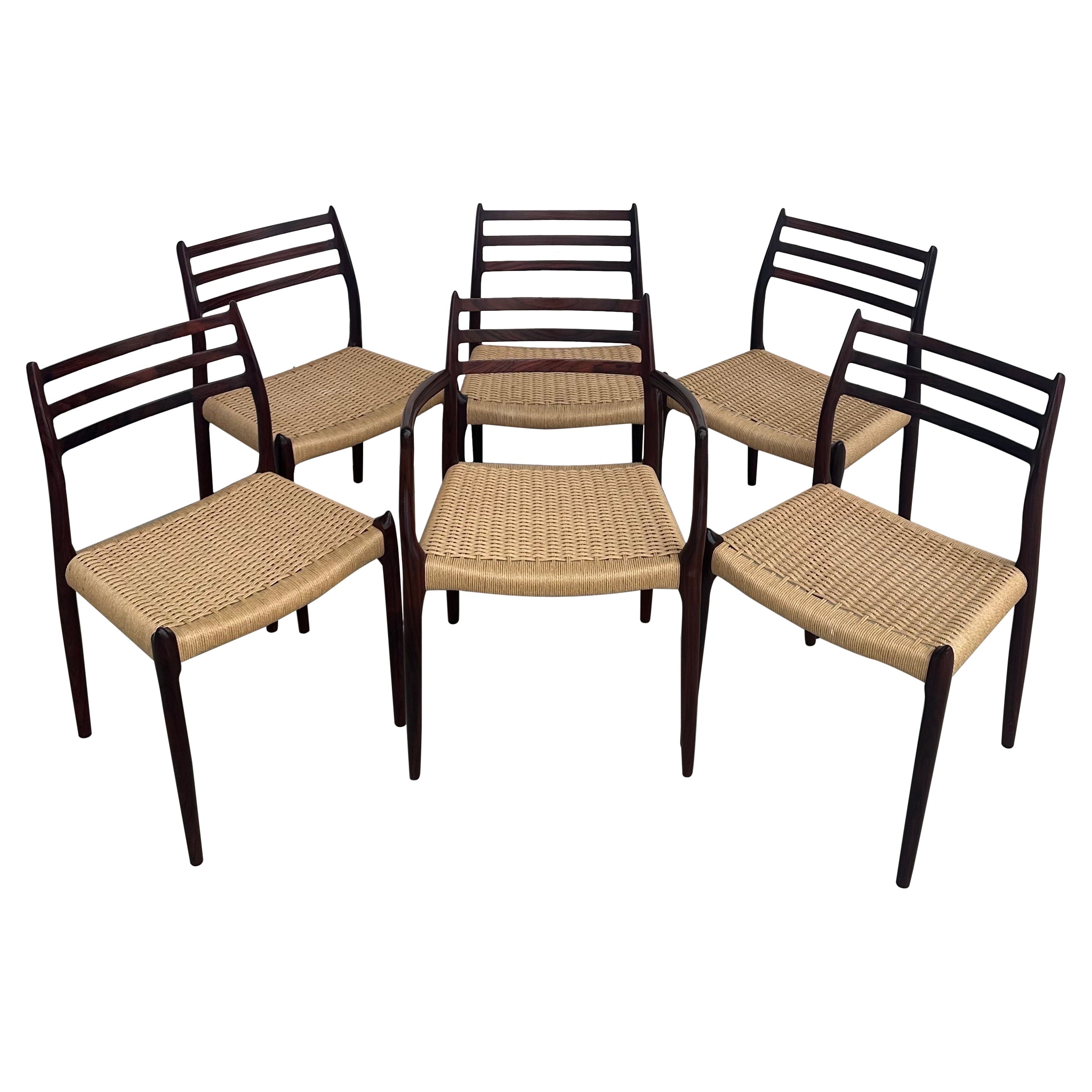 Set of Six Danish Modern Rosewood and Papercord Dining Chairs by Niels Moller For Sale