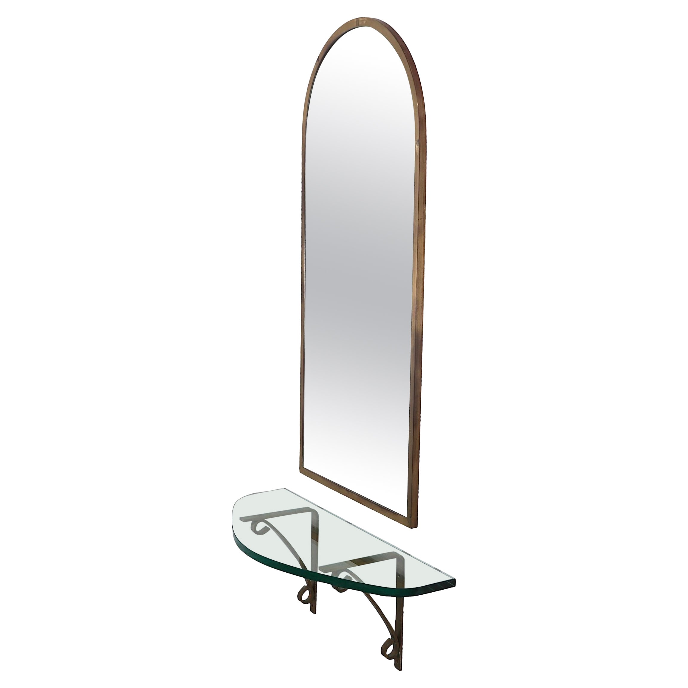 Arched Top Brass Framed Mirror over Wall Mount  Glass Shelf with Brass Supports For Sale