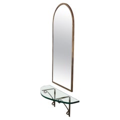 Used Arched Top Brass Framed Mirror over Wall Mount  Glass Shelf with Brass Supports