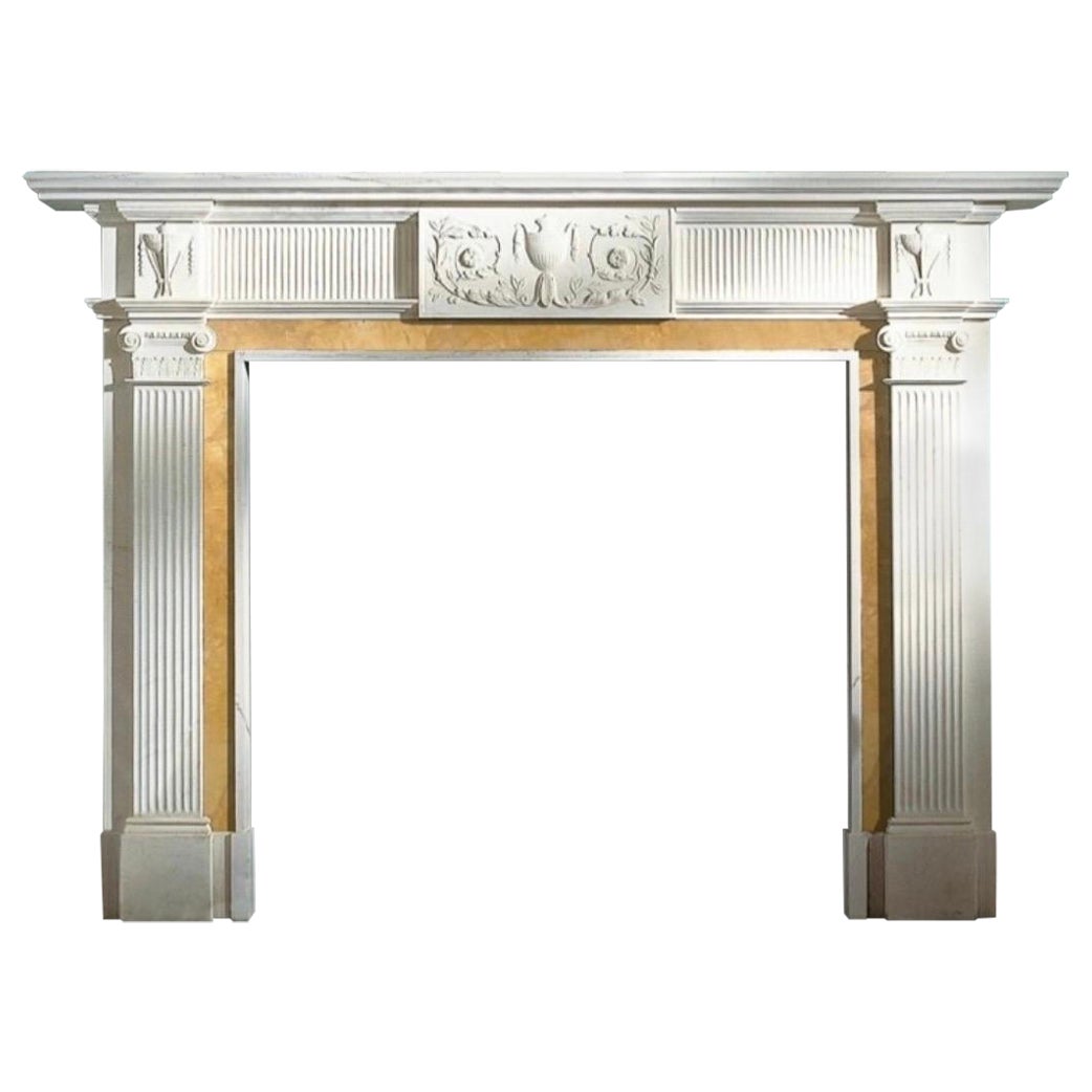 A Large Georgian Manner Carved Statuary & Sienna Marble Fireplace Surround.