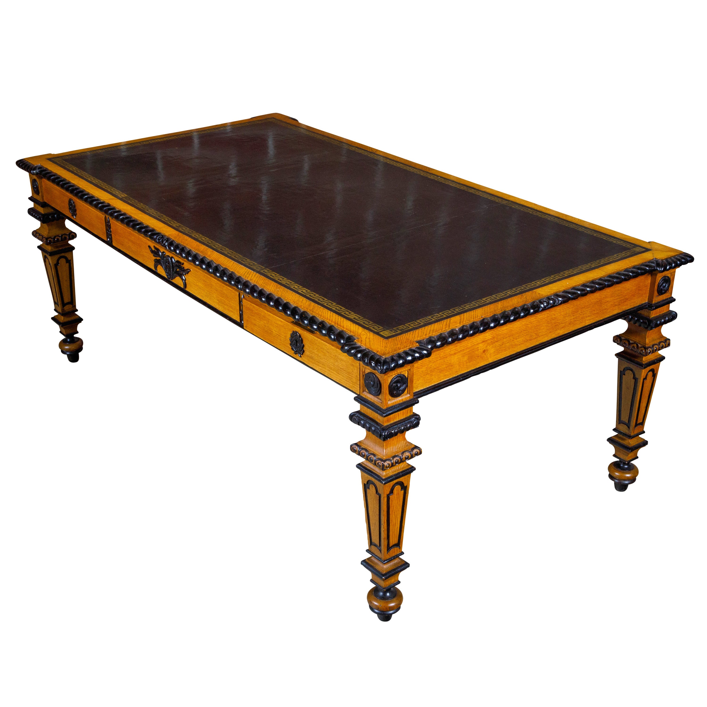 English 19th Century Oak Desk with Ebonized Accents and Gilded Greek Key Frieze For Sale