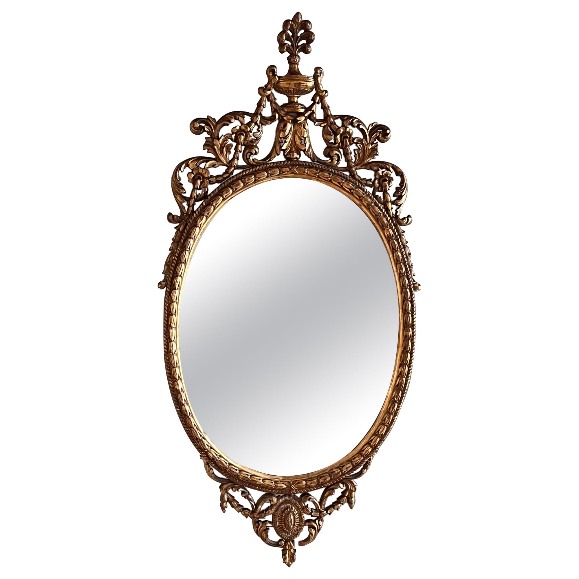 Miroir ovale doré de la fin du XVIIIe siècle