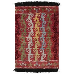 Rug & Kilim's Caucasian Tribal Rug in Red with Vine Scroll Pictorials (tapis tribal caucasien en rouge avec rouleaux de vigne) 