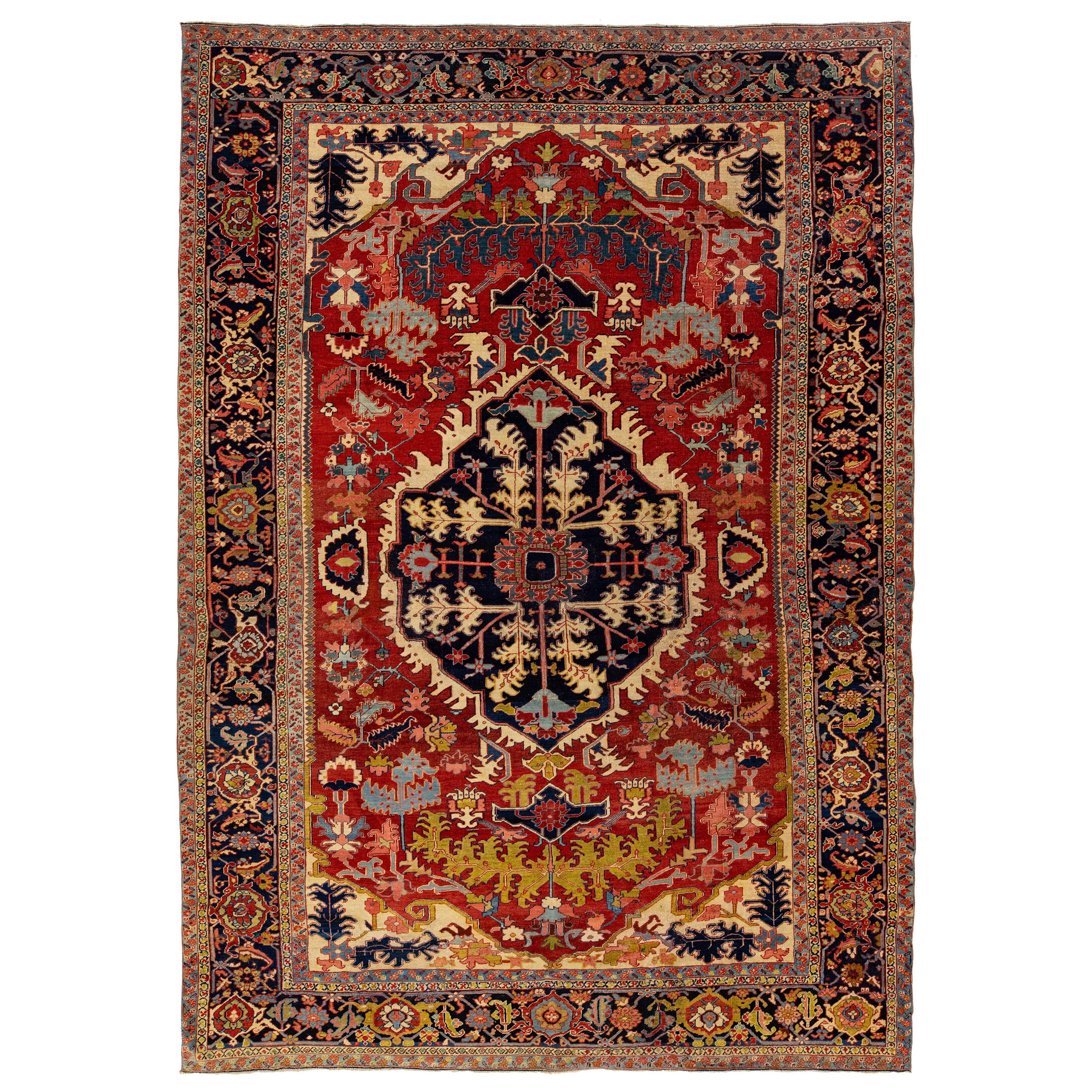 1900s Antique Handmade Wool Rug Persian Heriz Featuring a Medallion Motif 