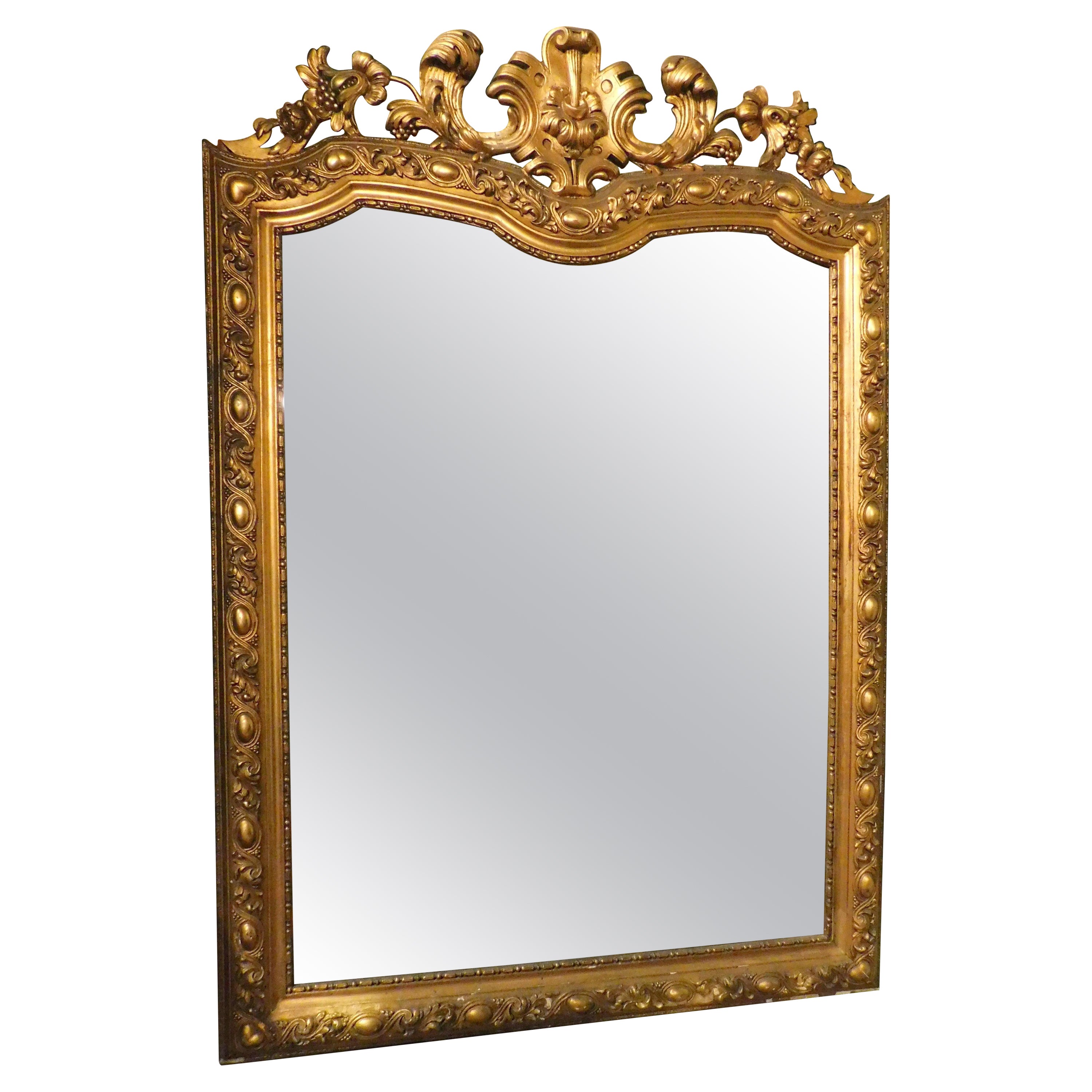 Gilt wooden wall consolle mirror with carved cymatium, Italy For Sale