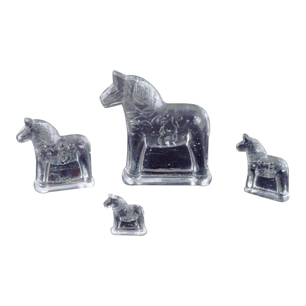 Swedish glass artist. Four Dala horses in clear mouth-blown art glass.  For Sale