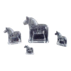 Vintage Swedish glass artist. Four Dala horses in clear mouth-blown art glass. 