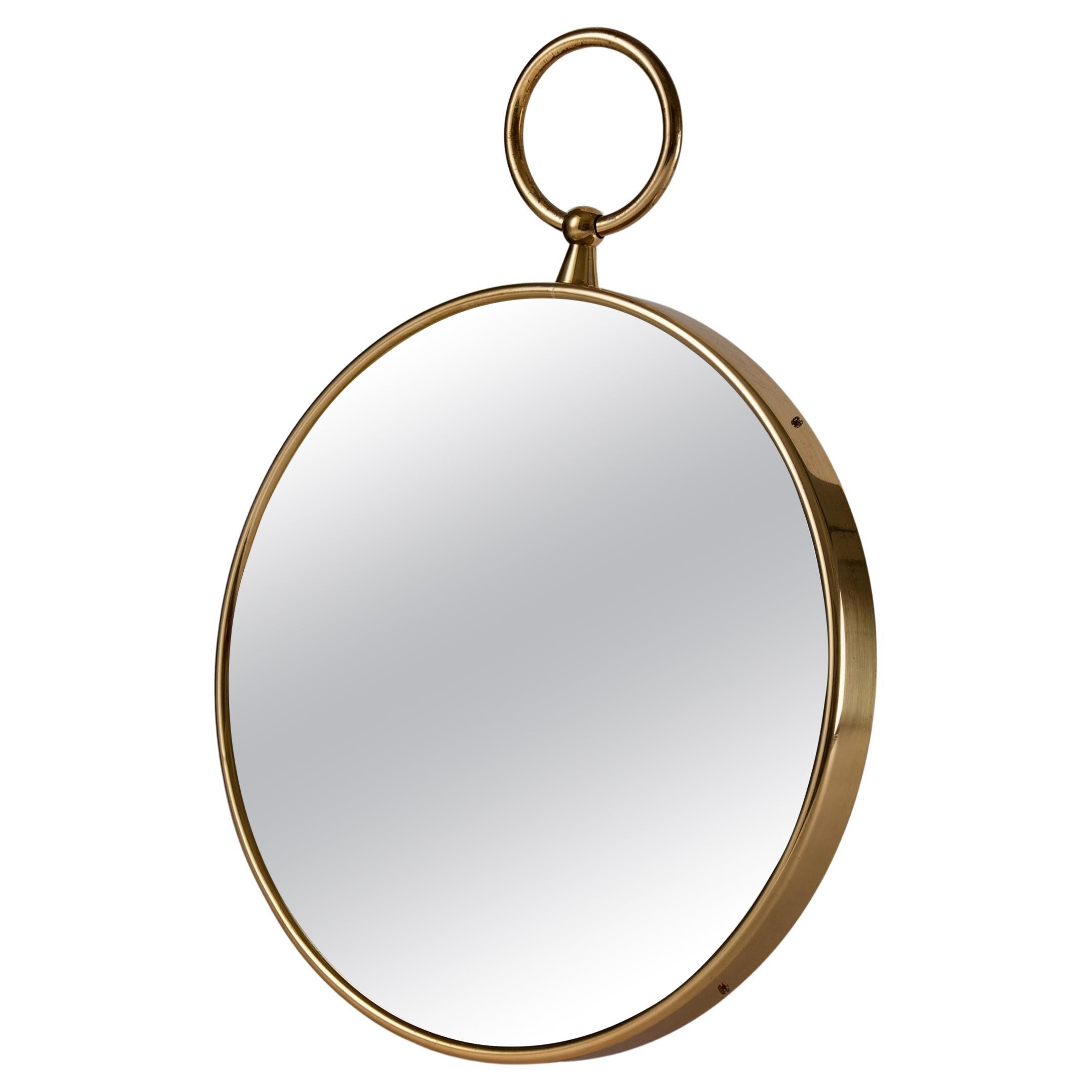 Round brass mirror designed by Piero Fornasetti for Svenskt Tenn, Sweden, 1980s For Sale