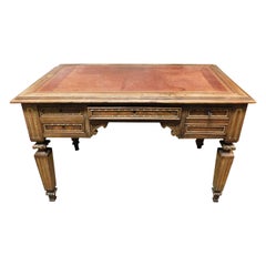 Carved empire desk, in walnut with opening side shelves, Italy