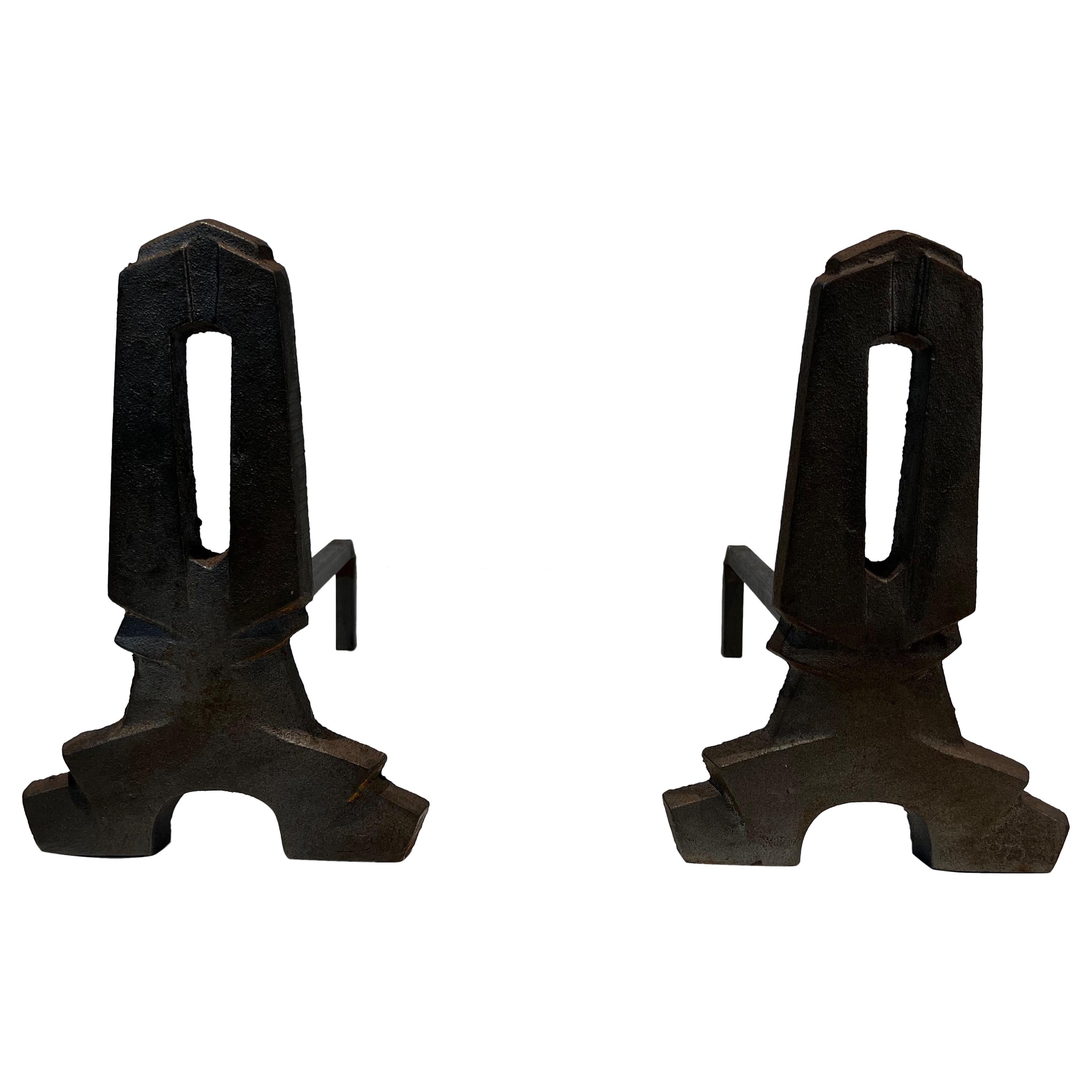Pair of modernist cast iron and wrought iron andirons. French work. Circa 1940
