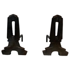 Pair of modernist cast iron and wrought iron andirons. French work. Circa 1940