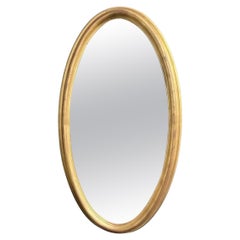 Miroir contemporain encadré de bois doré