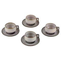 Bing & Grøndahl, "Tema". Four sets of tea cups with saucers in stoneware. 