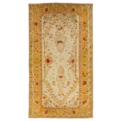 Antique 19th Century Turkish Oushak Wool Rug In Beige Color And Allover Motif