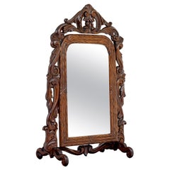 Late 19th century carved oak rococo revival vanity mirror