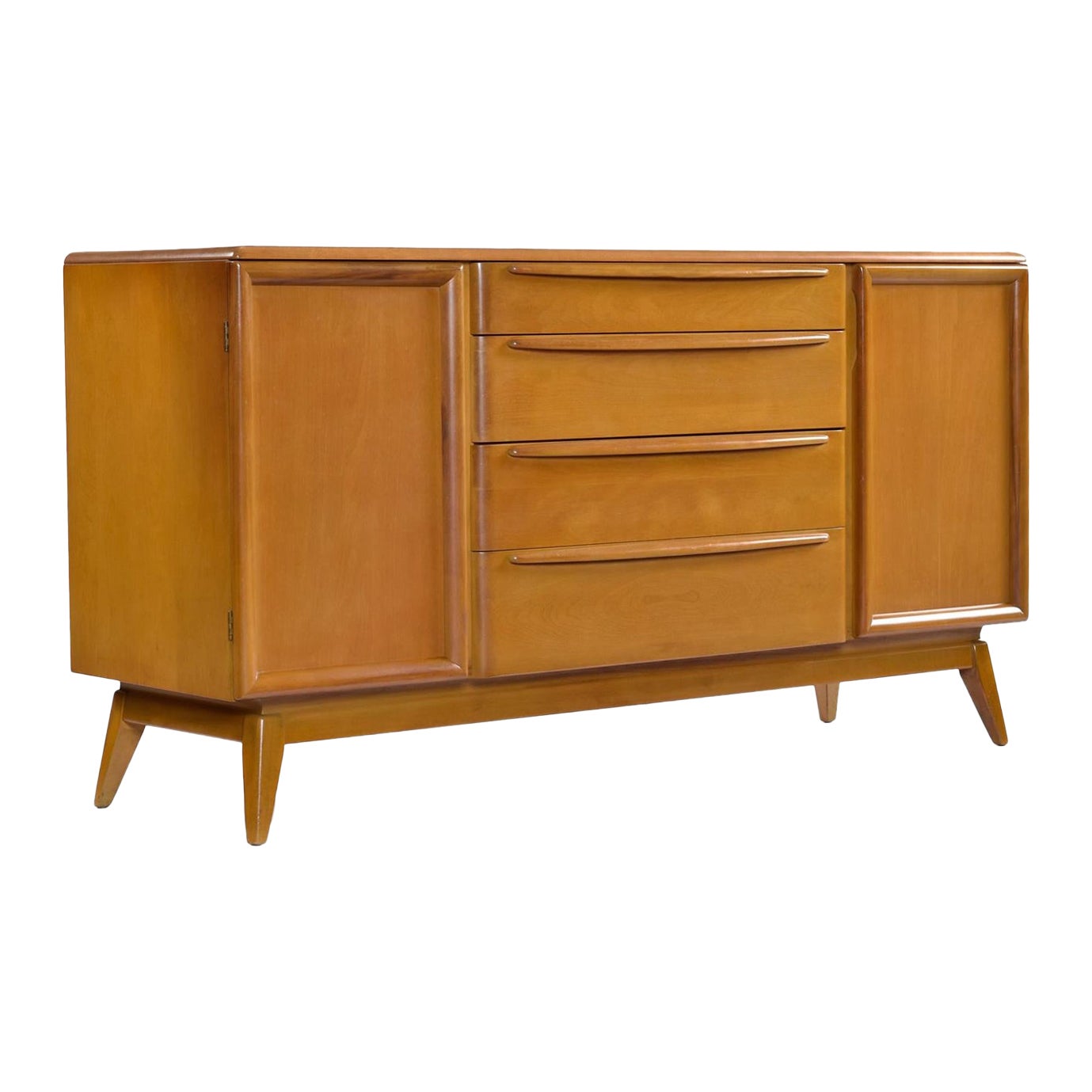 Versatility abounds with this Heywood Wakefield credenza.  Buffet, media cabinet, or entryway console are just a few ideas. As a dry bar, the adjustable / removable shelves will allow you to keep that whiskey collection cozy.  The top drawer sports