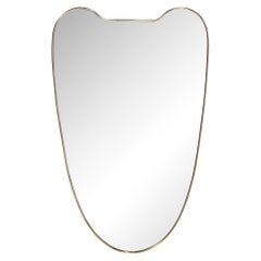 Mid-Century Modernist Brass Wrapped Shield Form Mirror