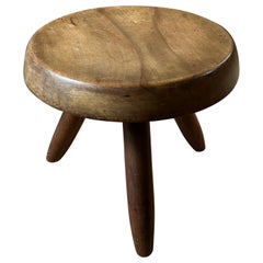 Mahogany Berger stool by Charlotte Perriand