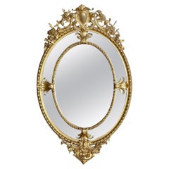 19th Century French Oval gilded wall mirror.