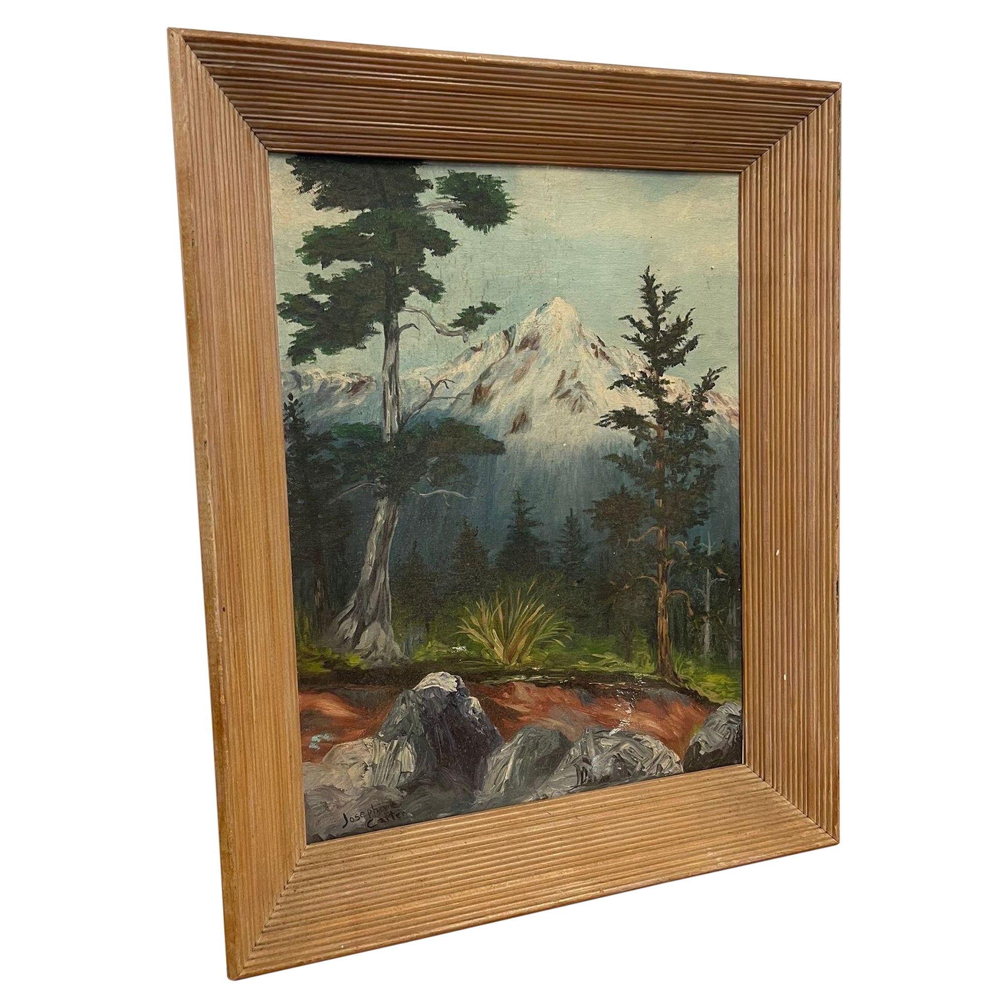 Peinture vintage encadrée et signée d'une montagne dans la forêt.