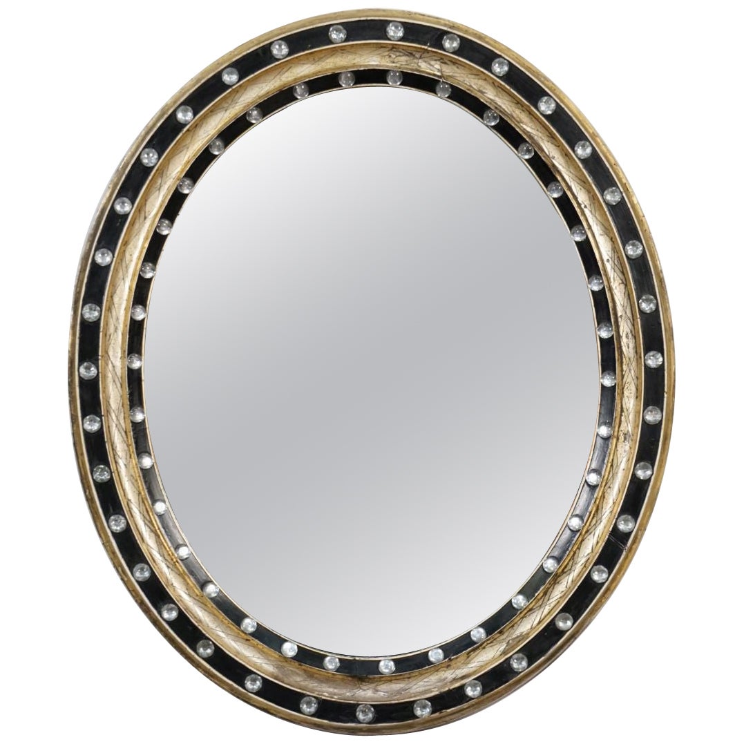 Ovaler Spiegel aus irischem Ebenholz und vergoldet mit facettierten Glasnieten (H 24 3/8 x B 20 1/2)  im Angebot