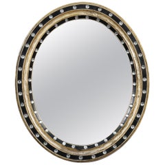 Miroir ovale irlandais en ébène et doré avec clous en verre facetté (H 24 3/8 x L 20 1/2) 