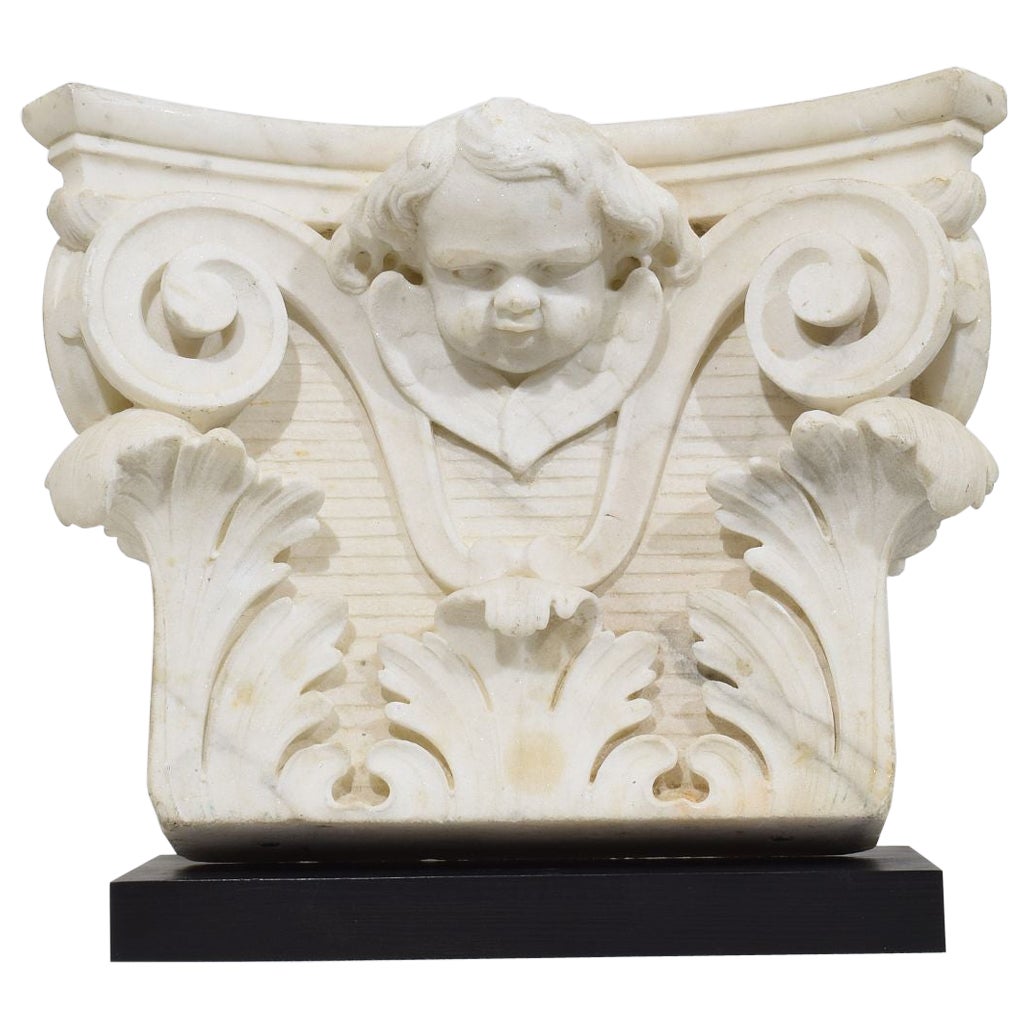 French, 18th Century, Carved White Marble Capital With Angel Head For Sale
