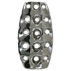Retro sculptural Space Age style vase in chromed ceramic, with holes