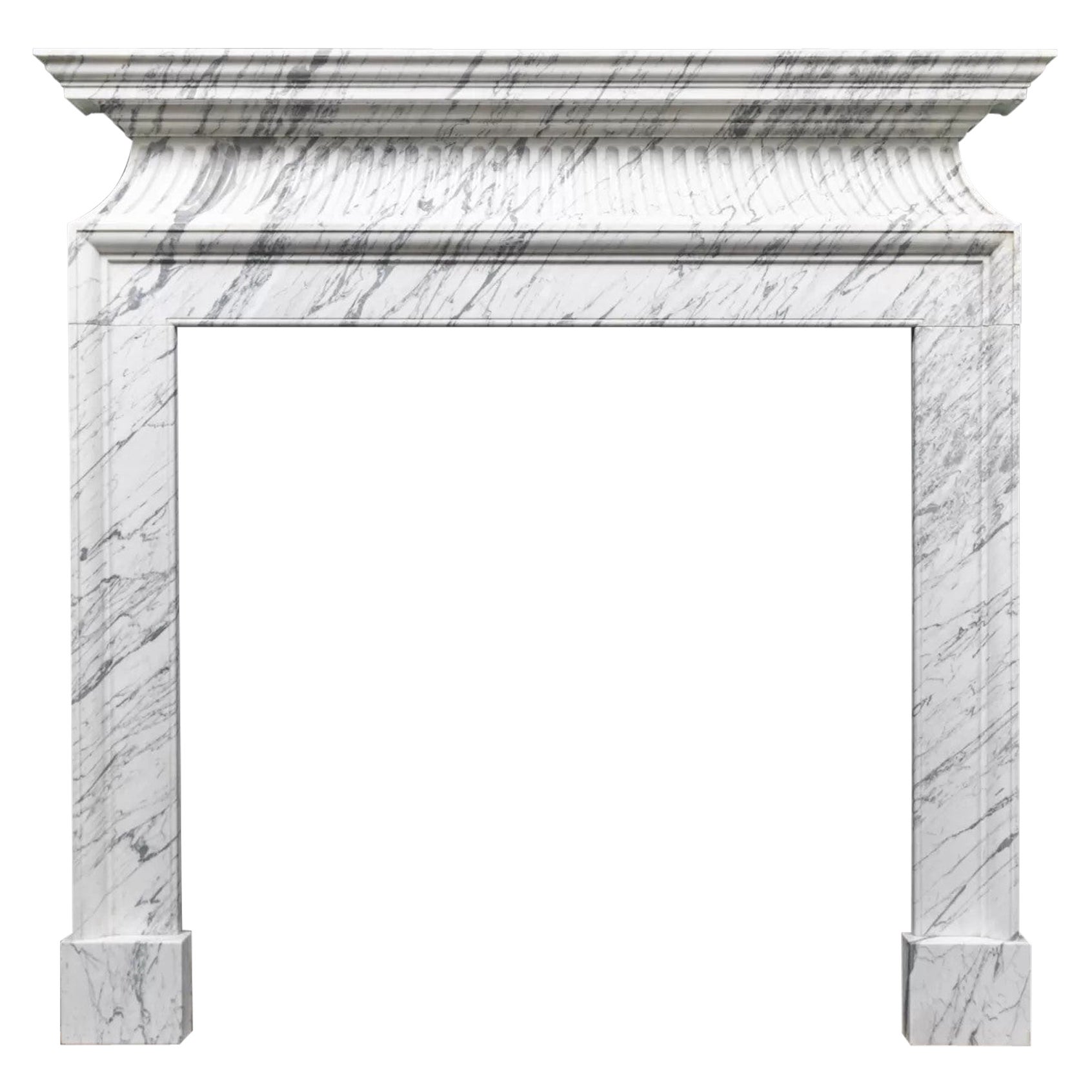 A neoclassical style fire surround in Italian Carrara Marble by Ryan and Smith For Sale