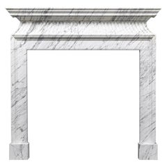 A neoclassical style fire surround in Italian Carrara Marble by Ryan and Smith