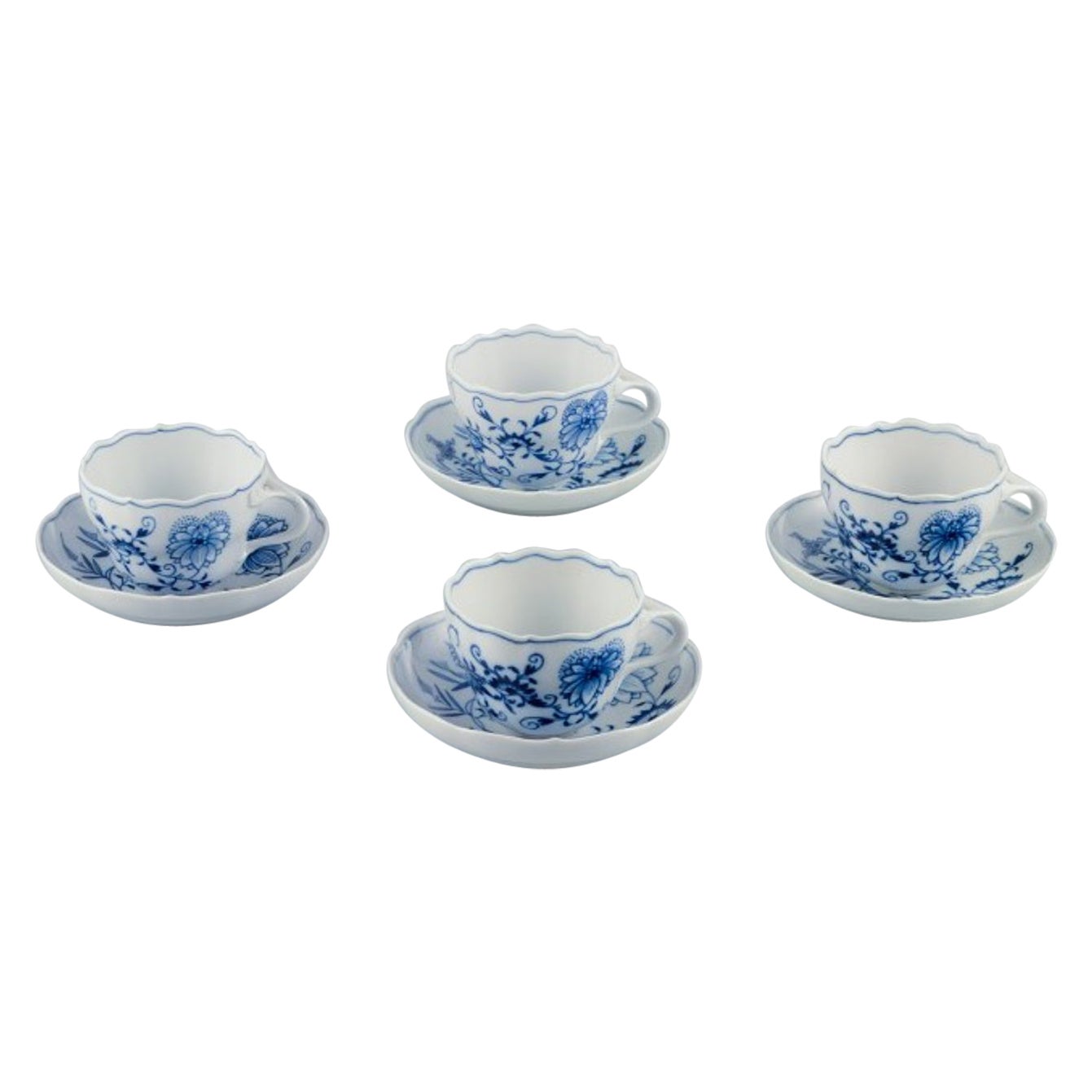 Meissen, Germany. Four Blue Onion coffee cups with saucers in porcelain.