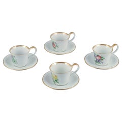 Bing & Grøndahl. Four antique coffee cups with high handles and saucers.