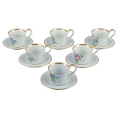 Bing & Grøndahl. Set of six antique coffee cups with high handles and saucers.