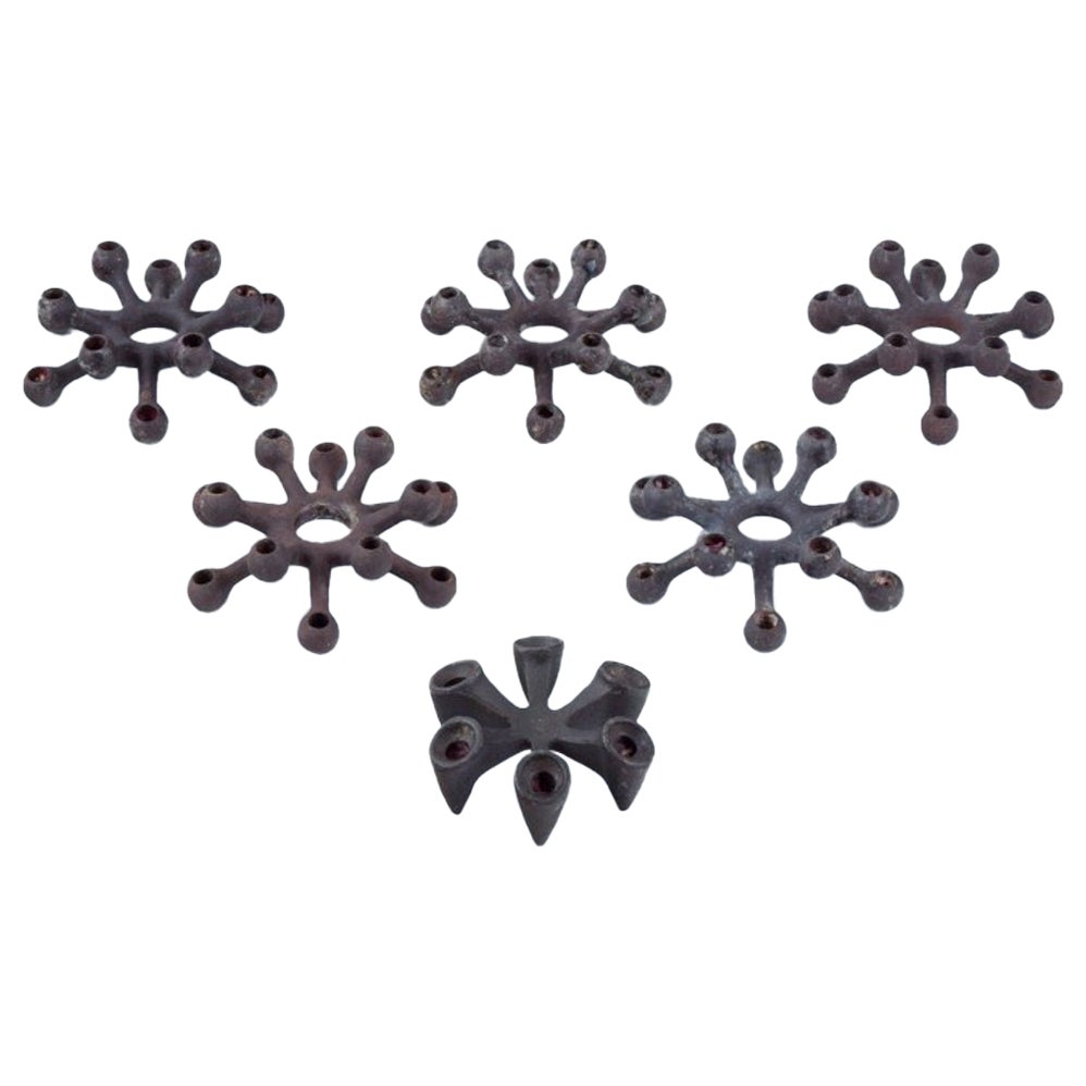 Jens Harald Quistgaard for Dansk Designs. Set of six candle holders in cast iron For Sale
