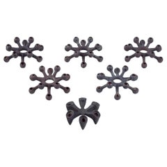Jens Harald Quistgaard for Dansk Designs. Set of six candle holders in cast iron