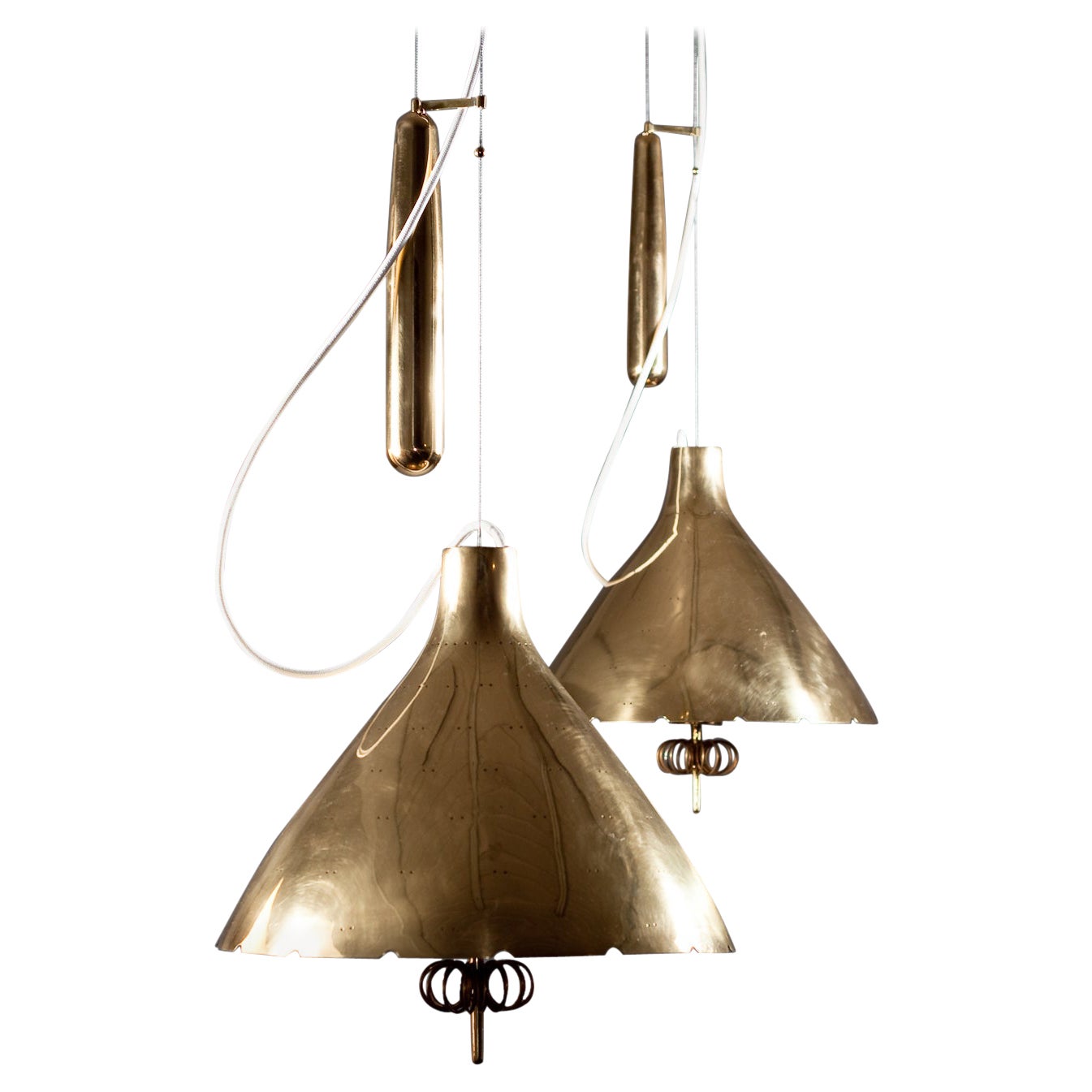 Paavo Tynell, pair of 1940's brass counterweight pendant lamps, Taito Oy