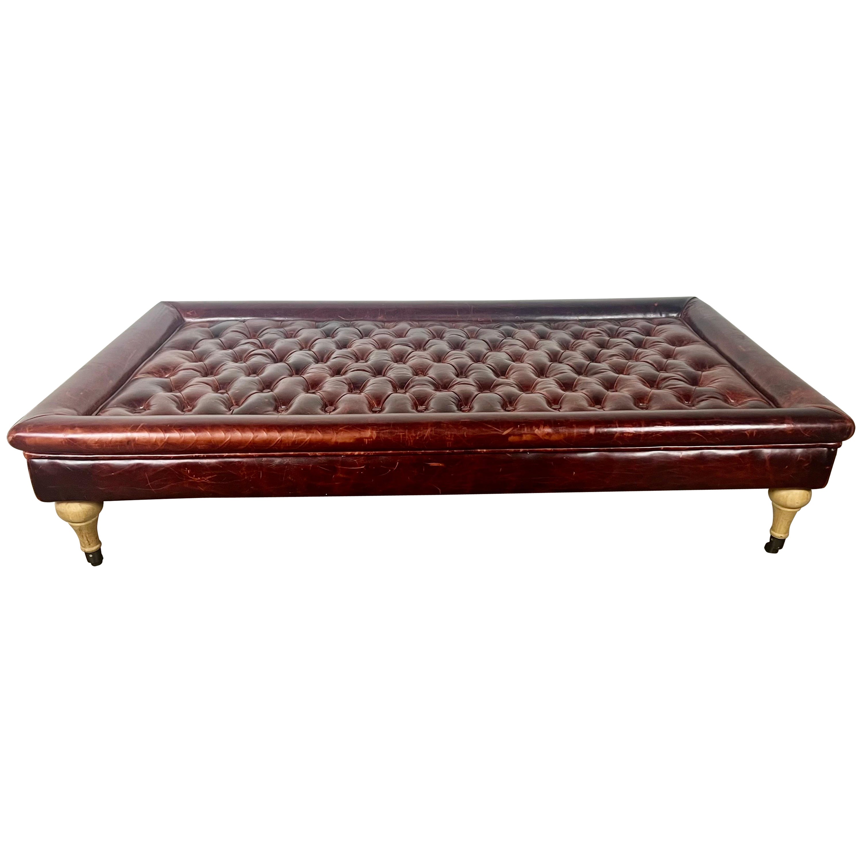 English Leather Tufted Ottoman on Casters For Sale
