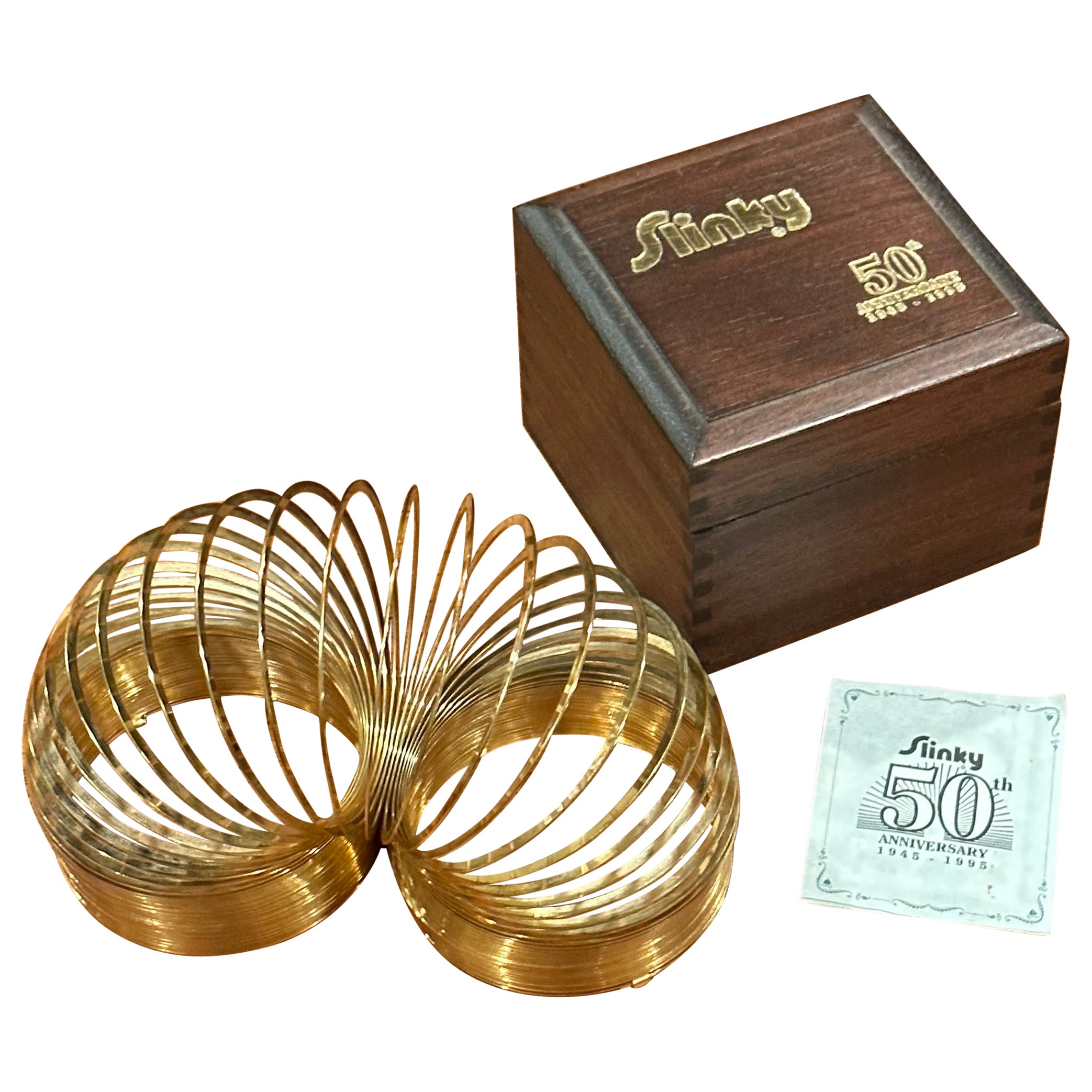 50th Anniversary Gold-Plated Slinky Toy in Wood Box For Sale
