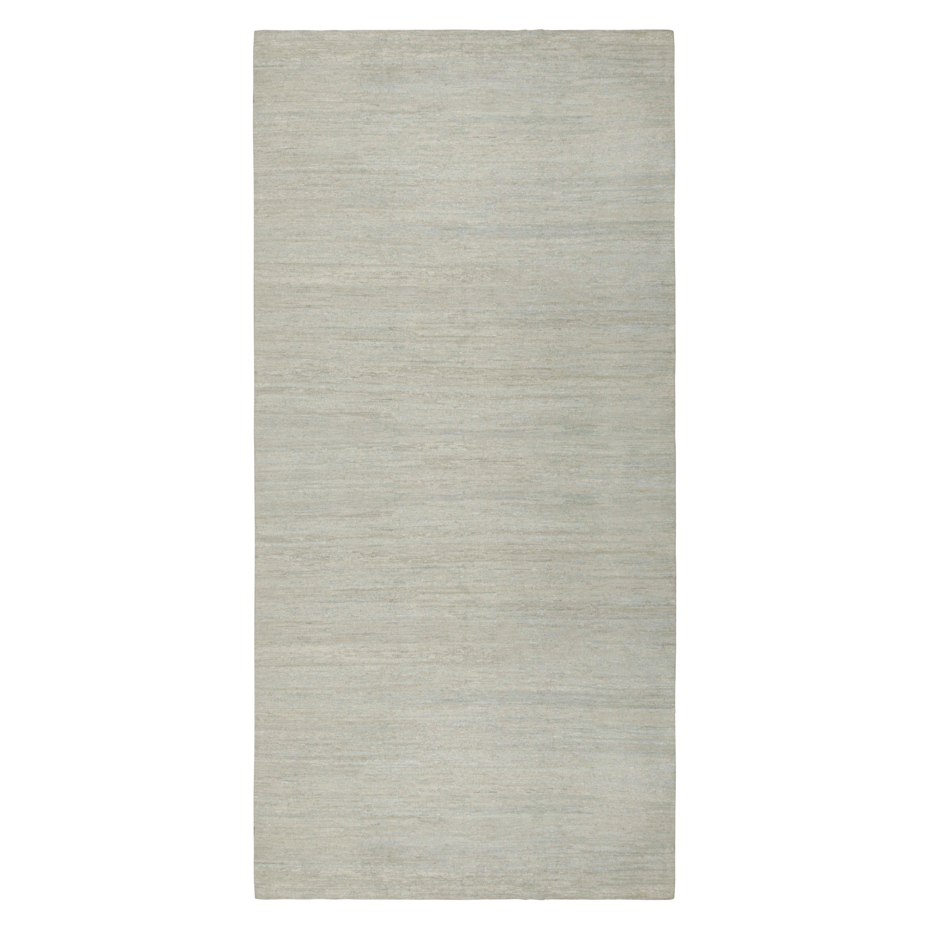 Hand-knotted in wool, this 9x17 contemporary rug in beige and gray as an addition to the Rug & Kilim Textural Collection, is an inventive take on solid rugs with movement in its subtle striae. 

On the Design: 

The collection enjoys an inventive