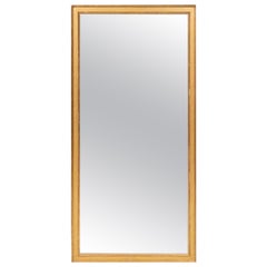 Grand miroir biseauté en bois doré