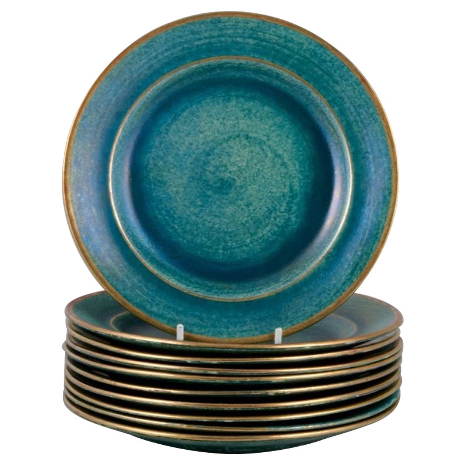 Josef Ekberg for Gustavsberg, Sweden. Set of ten ceramic plates.