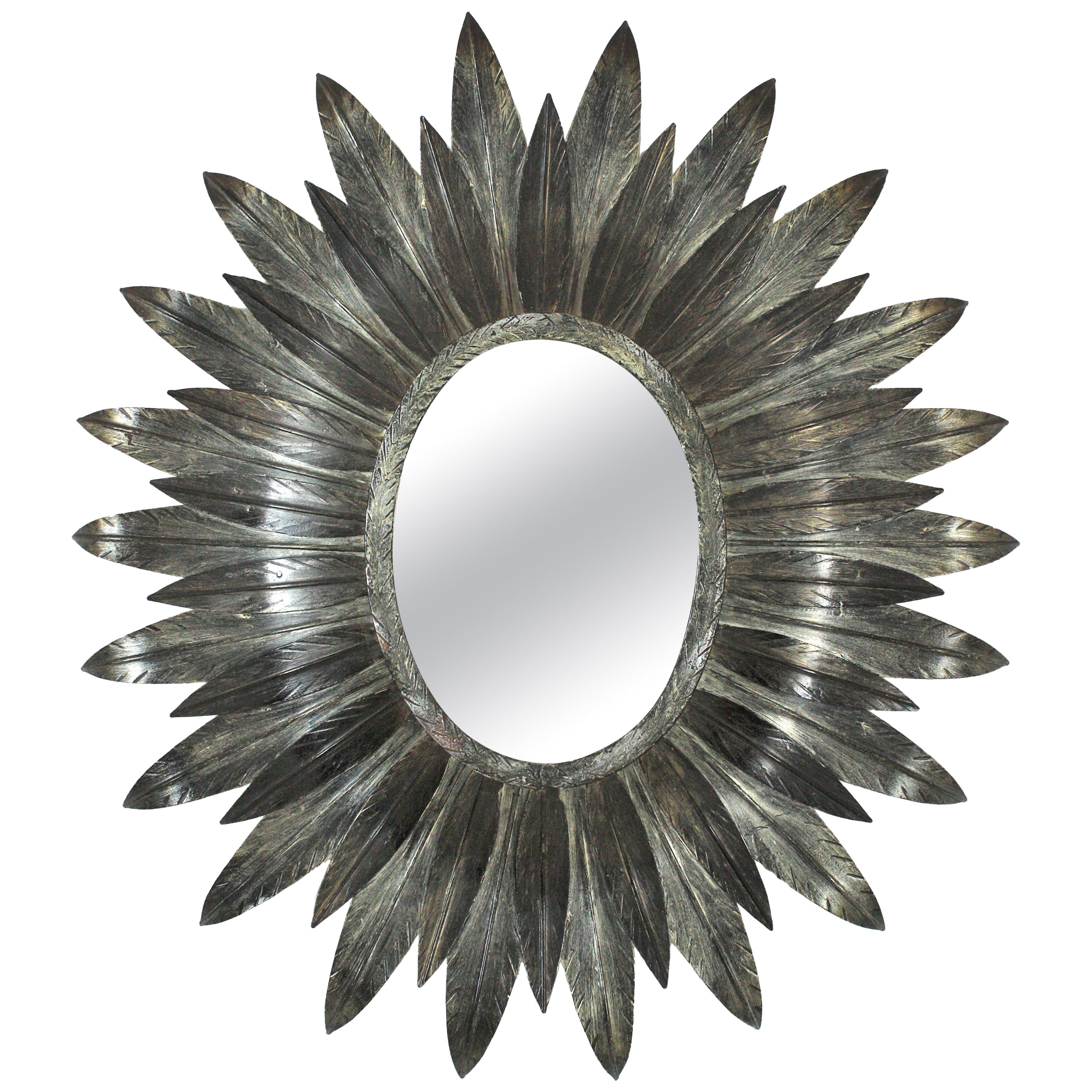 Miroir ovale Sunburst espagnol en métal argenté en vente