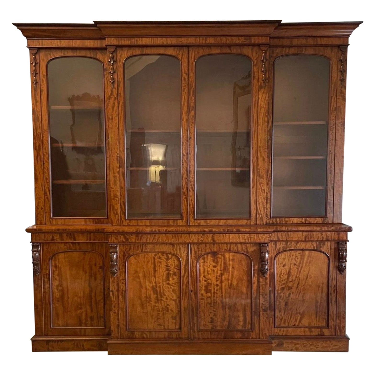 Outstanding Quality Large Antique Victorian Figured Mahogany Breakfront Bookcase For Sale
