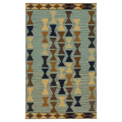 Rug & Kilim's Scandinavian Style Rug in Blue with Beige-Brown Geometric Patterns (tapis de style scandinave en bleu avec des motifs géométriques beige et marron)