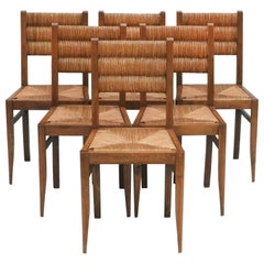 Chaises de salle à manger de style Victor Courtray en chêne et jonc, C1950 France