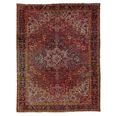 Antique Persian Heriz Wool Rug Featuring an Allover Motif In Red